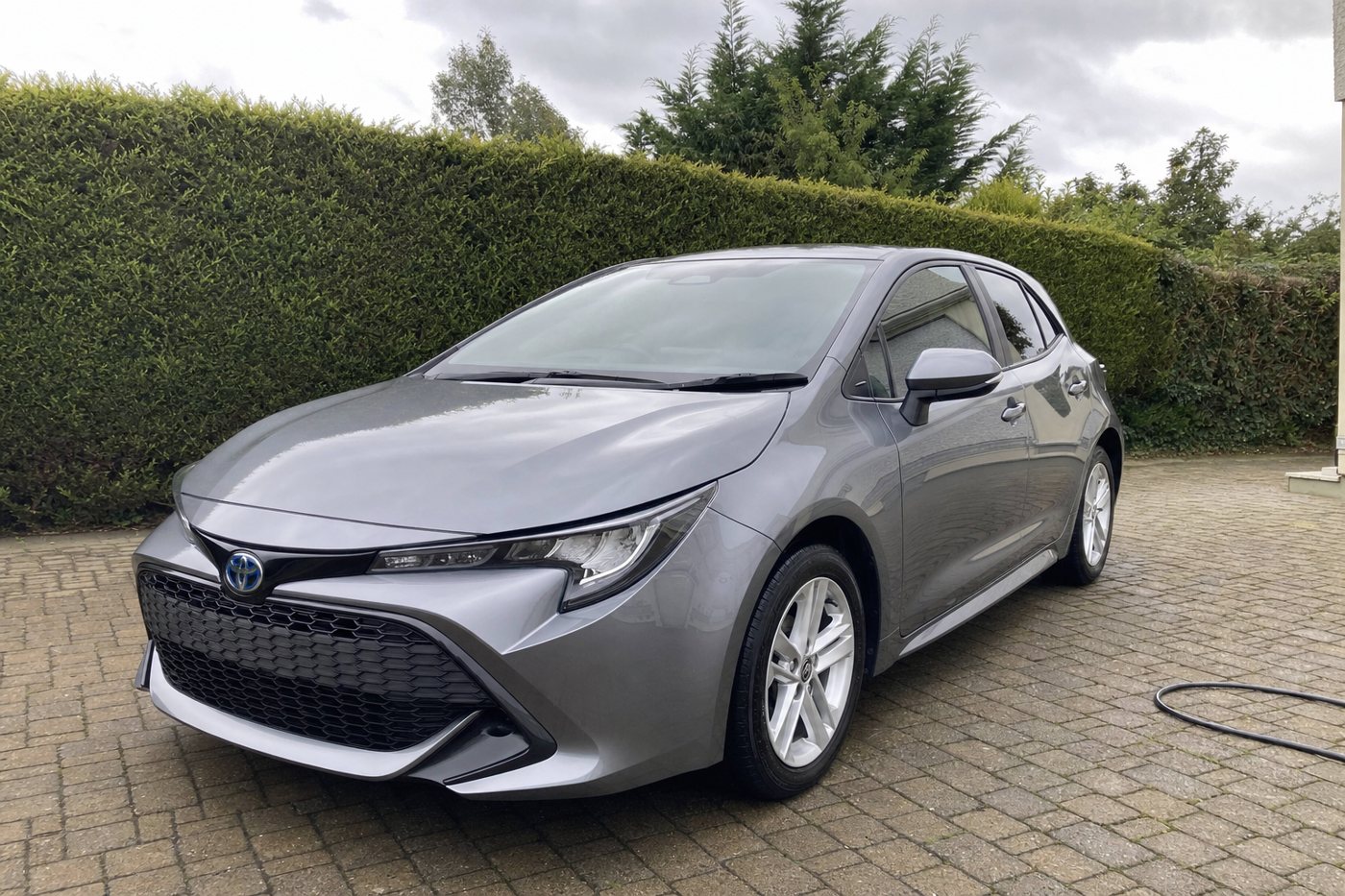 a detailed silver hatchback after detailing