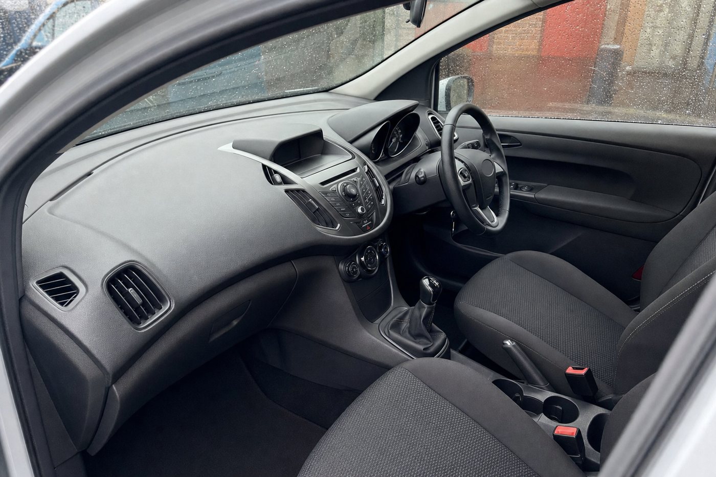 a cleaned dashboard and centre console after detailing